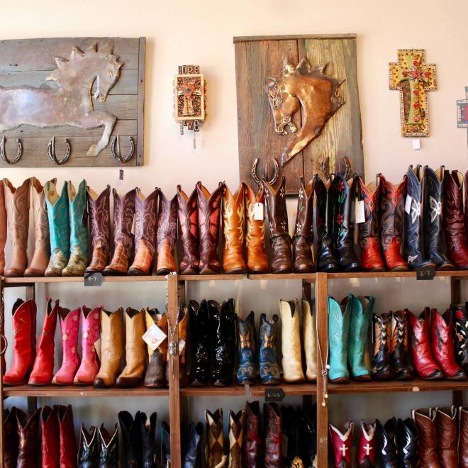 A display of vintage and secondhand boots from My Flaming Heart, a handmade and vintage boutique store in Houston Texas, USA.